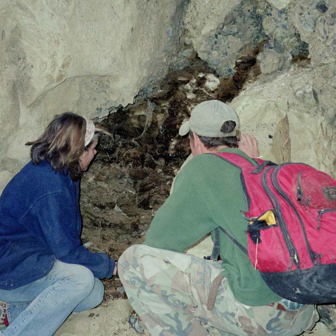 Felisa Smith and Ian Murray studying a midden in Death Valley
